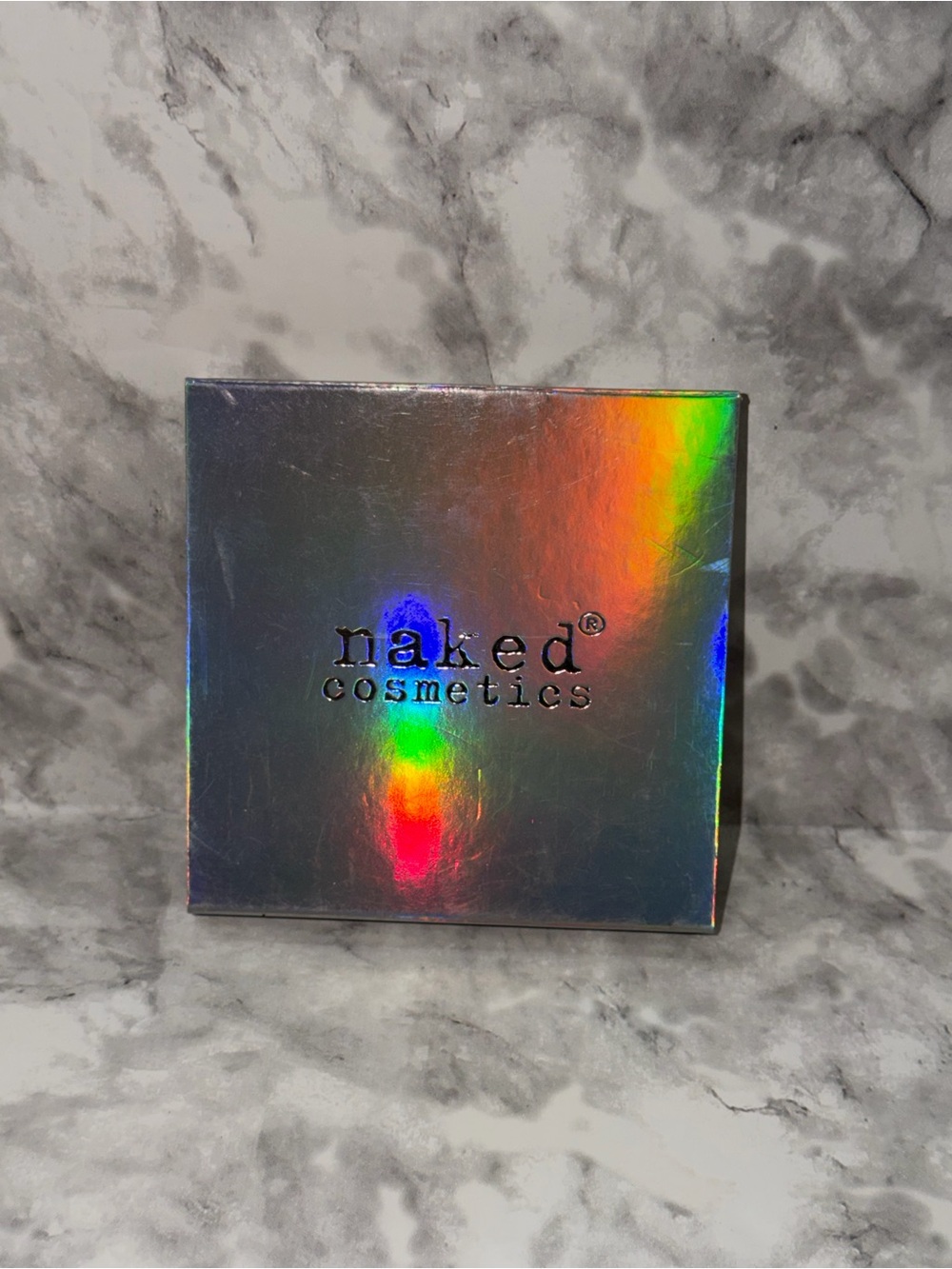naked cosmetics holographic highlighter compact - silver with rainbow sheen